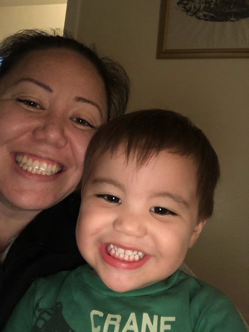 Photo of Otome Lindsey, a smiling white woman smiling with her son